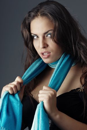 Sexy lady with blue scarf expressing alertnessの写真素材