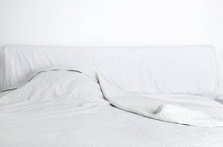 White doube bed in the bedroomの写真素材