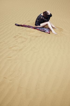 Lonely depressive woman lost in the hot desertの写真素材