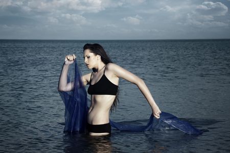 Dramatic photo of the woman in the waterの写真素材