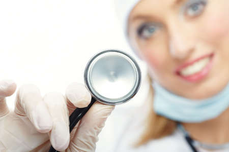Close-up photo of the stethoscope in the hand of female doctor. Focus on stethoscopeの写真素材
