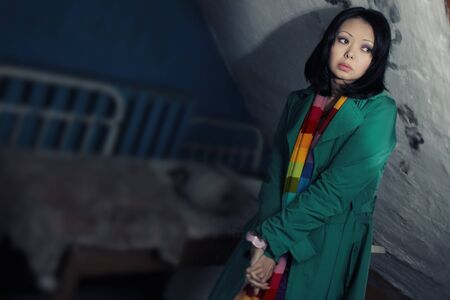 Sad stylish woman indoors. Special defocus effect taken from tilt-shift lensの写真素材
