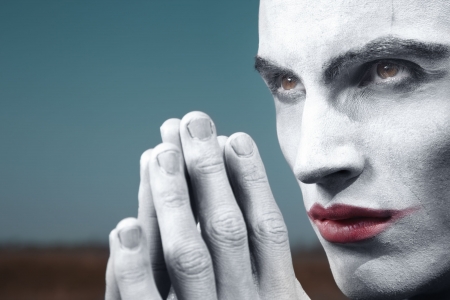 Angry vampire praying outdoors. Horizontal photo, special colors and darkness added の写真素材