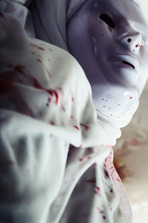 Mummy with mask and bloody spot. Artistic darkness and colors addedの写真素材