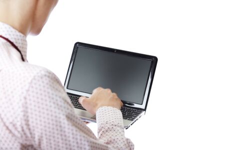 Unrecognizable businessperson using laptop on a white backgroundの写真素材