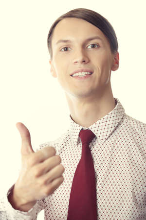 Successful businessman making thumbs up gestureの写真素材