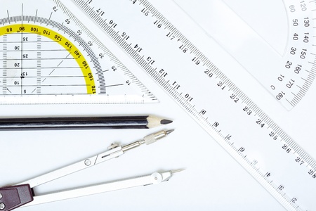 Scheme with compasses rulers and pencil. Close-up photo
