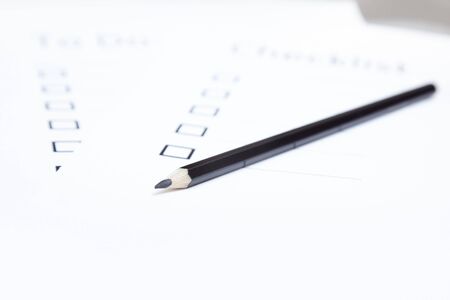 Black pencil on a daily plan. Horizontal photoの写真素材