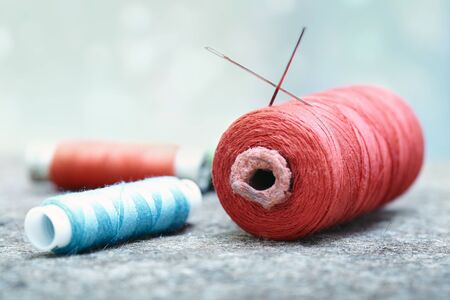 Sewing spools on a woolen fiber. Close-up photoの写真素材
