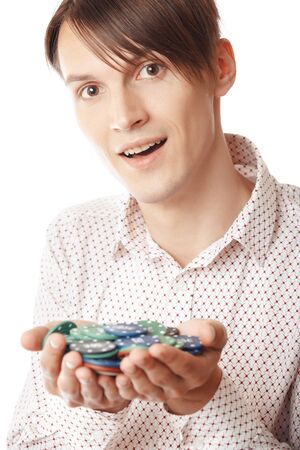 Glad man holding casino chips on a white backgroundの写真素材