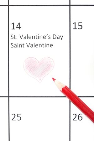Red pencil on a calendar with Saint Valentine Dayの写真素材