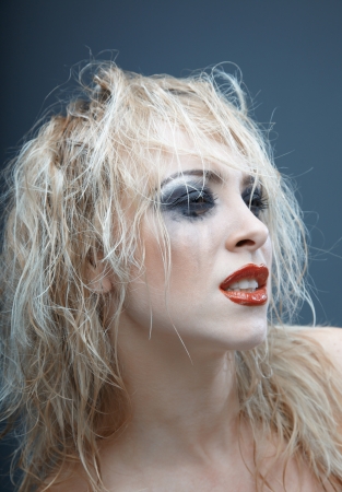 Blond female witch with strange makeup.  の写真素材