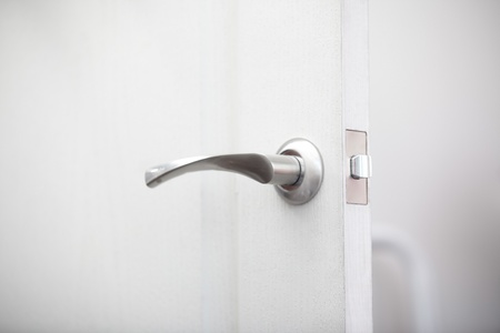 Close-up view on the wooden door with metal handleの写真素材