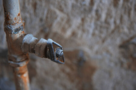 Old rusty tap. Horizontal close-up photoの写真素材
