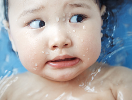 Afraid child in the bath. Close-up horizontal photoの写真素材