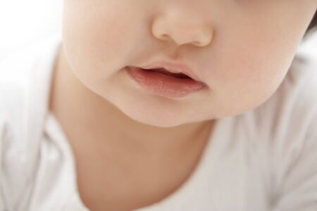 Mouth of the child. Close-up horizontal photoの写真素材