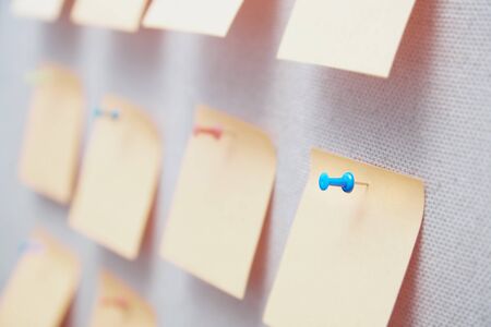 Sticky notes on a bulletin board. Close-up viewの写真素材