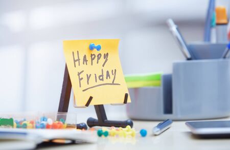 Friday text on adhesive note at officeの写真素材