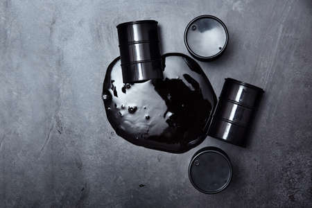 Containers with oil spilled at industrial siteの写真素材