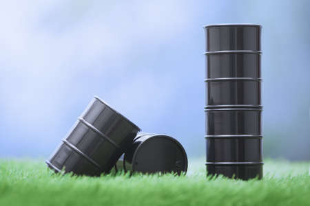 Four oil barrels in the grassland. Horizontal photoの写真素材