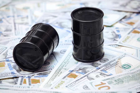 Oil drums on US dollars backgroundの写真素材