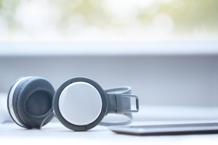 Headphones and digital tablet at officeの写真素材