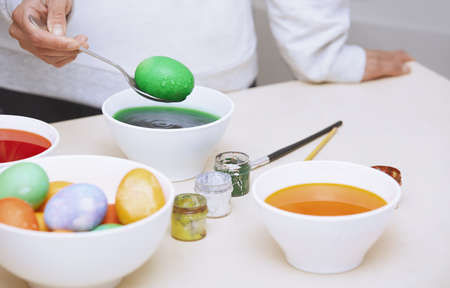 Woman preparing Easter eggsの写真素材