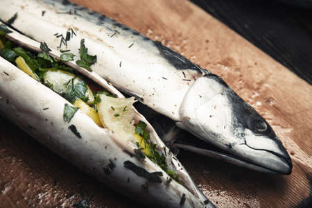 Fish stuffed by lemon and herbs with pepperの写真素材