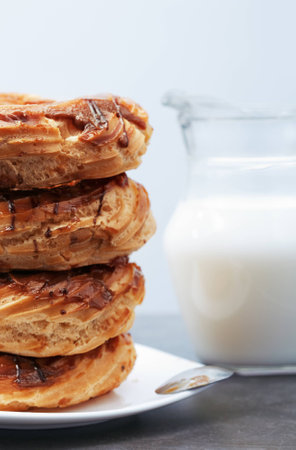 Glazed Doughnuts on a dessert plateの写真素材