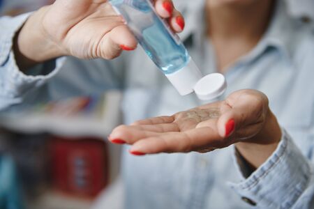 Woman using a moisturizing lotion for disinfectionの写真素材