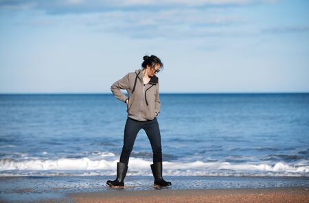 Happy woman having fun at the oceanの写真素材