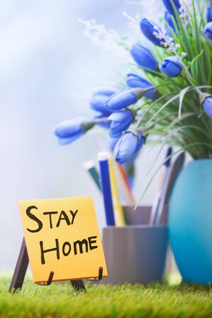 Adhesive note with Stay Home text at the green officeの写真素材