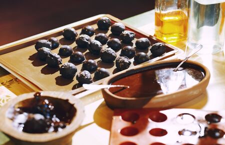 Homemade organic vegetarian chocolates on a tableの写真素材