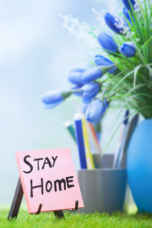 Adhesive note with Stay Home text at the green officeの写真素材