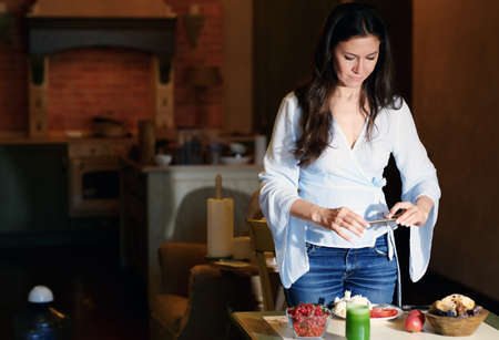 Woman making mobile photo of healthy food for her Internet blogの写真素材