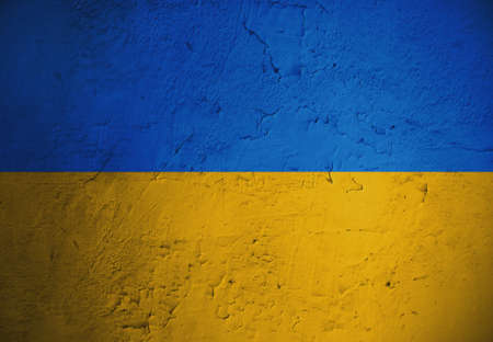 Grungy and damaged wall painted with blue and yellow paint like  Ukrainian flagの写真素材