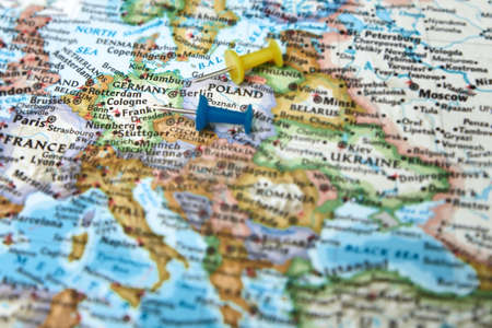 Pushpins on a map with focus on Germanyの写真素材