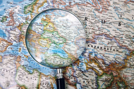 Ukraine under magnifying glass on mapの写真素材