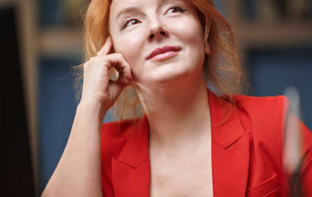 Day dreaming businesswoman at her officeの写真素材