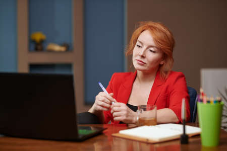 Businesswoman having video call at the officeの写真素材