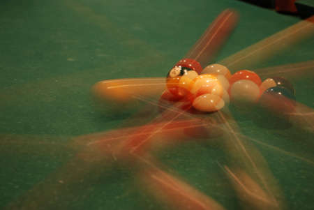 Photo of a billiard table together with spheres