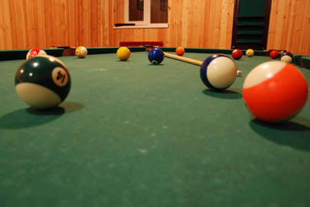 Photo of a billiard table together with spheres