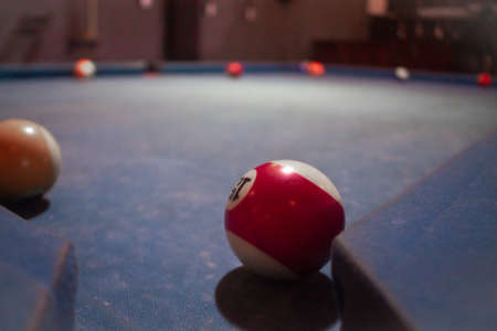 Billiard balls on blue billiard table. Billiard balls on blue billiard tableの写真素材