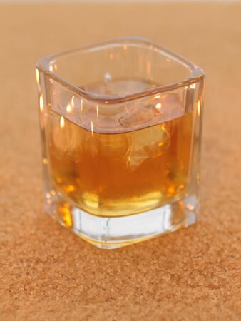Whiskey on the rocks on sugar backgroundの写真素材