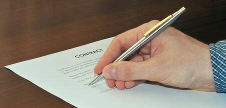 Businessman signing a contractの写真素材