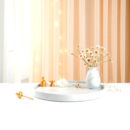 Beautiful composition of flowers in vase on white table in roomの写真素材