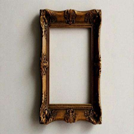 Old wooden picture frame on a white wall background with copy space.の写真素材
