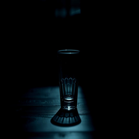 Empty glass on a wooden table. Selective focus.の写真素材