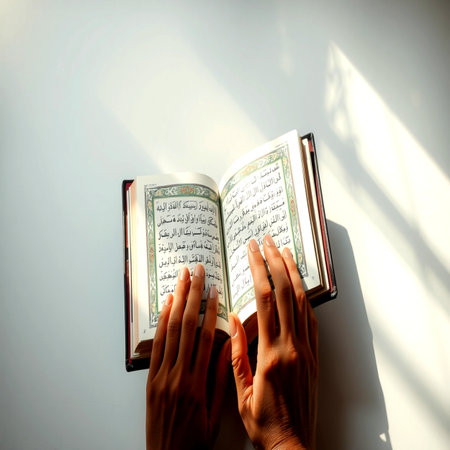 Hands of a Muslim woman reading the holy Quran on a white backgroundの写真素材