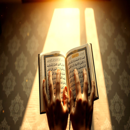 Hands of a woman reading the holy Quran in the rays of the sunの写真素材